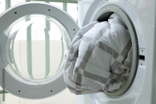 Quadro em tela Washing machine loaded with blanket.