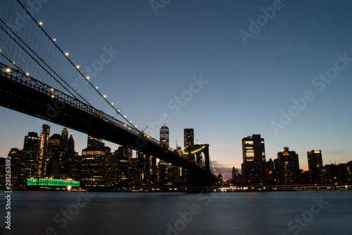brooklyn bridge and lower manhattan skyline at night © tatyalfano