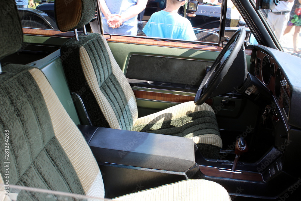 View of the steering wheel and cockpit dashboard in vintage style. Retro car. View of the steering wheel and cockpit dashboard in vintage style. Retro car.