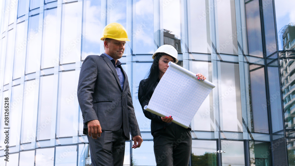 Team of architects and engineer in group on construciton site check documents and business workflow. Engineer inspection in workplace for architectural plan. Concept of: Woman, Man, Suite, Business. Team of architects and engineer in group on construciton site check documents and business workflow. Engineer inspection in workplace for architectural plan. Concept of: Woman, Man, Suite, Business.