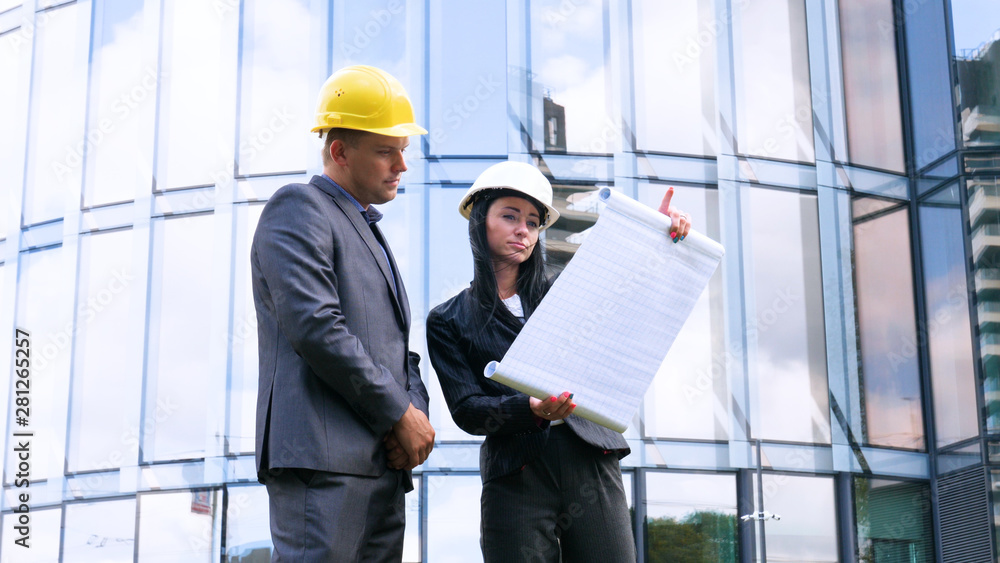 Team of architects and engineer in group on construciton site check documents and business workflow. Engineer inspection in workplace for architectural plan. Concept of: Woman, Man, Suite, Business.