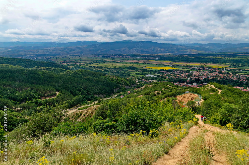 Obraz premium A view from path on the slope of the Stob Pyramids to the valley of the village of Stob, Rila mountain, Kyustendil region, Bulgaria, Europe 