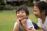 Thai Sister and brother having fun and happiness in a park