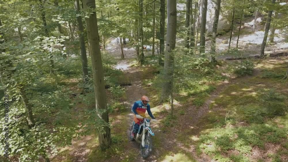 Extreme motorcyclist rides on the forest roads. Motocross. Motosport