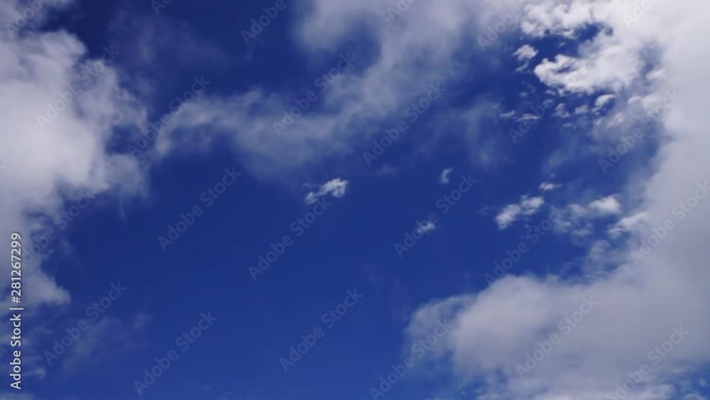 Beautiful cirrus clouds moving across a summer blue sky. Beautiful cirrus clouds moving across a summer blue sky.