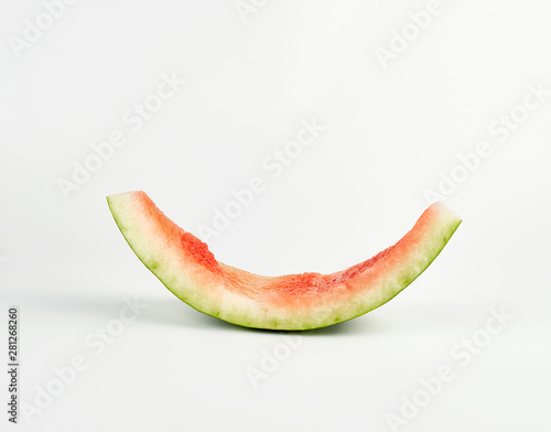 stub of red ripe round watermelon on a white background