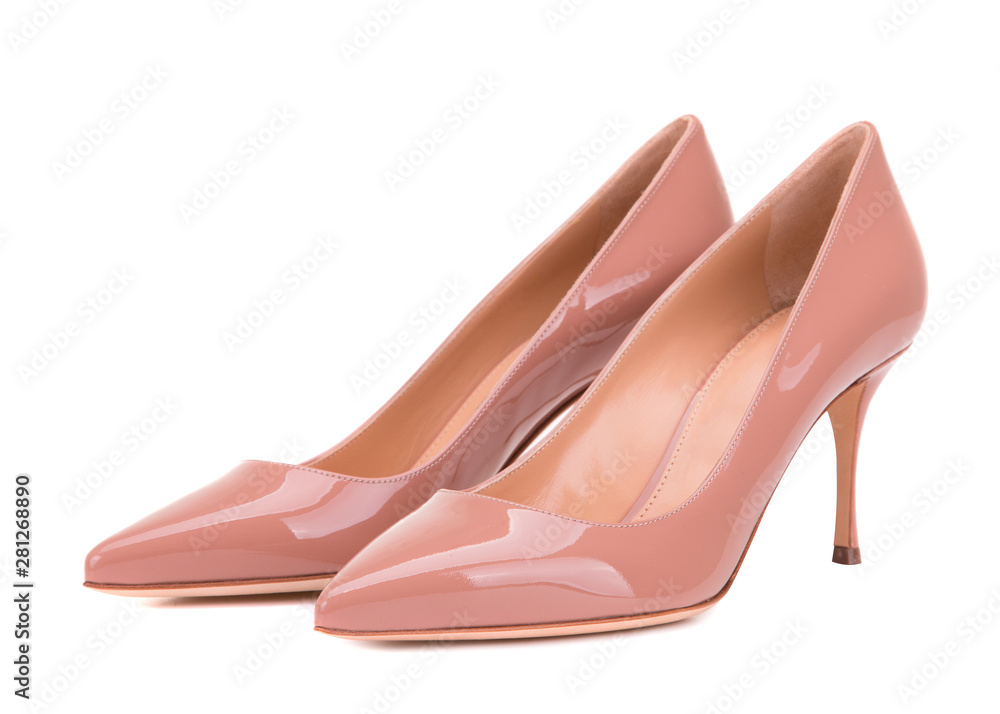 Varnished high-heeled shoes. Classic female shoes isolate on white background. Powder-colored shoes. Varnished high-heeled shoes. Classic female shoes isolate on white background. Powder-colored shoes.