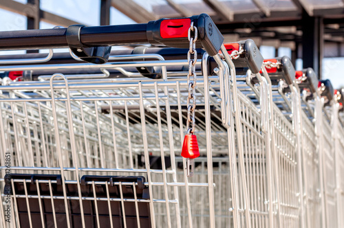 Shopping carts in the store, assembled in a row in the parking lot. Close-up.