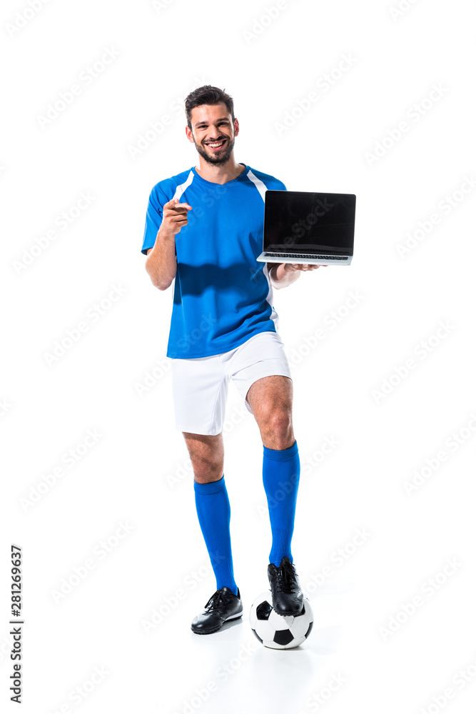happy soccer player with laptop pointing with finger Isolated On White happy soccer player with laptop pointing with finger Isolated On White