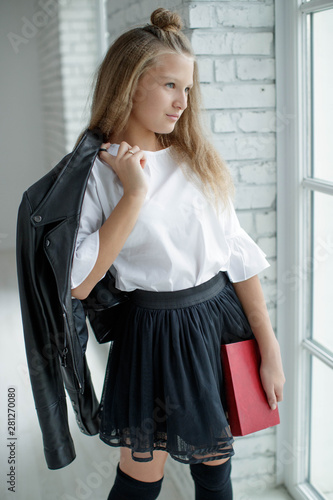 School fashion. Teen girl fashionable in school uniform. 