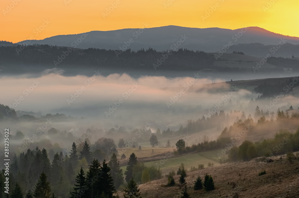 Beautiful autumn landscape at sunrise g in Carpathian mountains, Ukraine