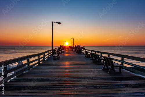 old wooden pier at sunrise