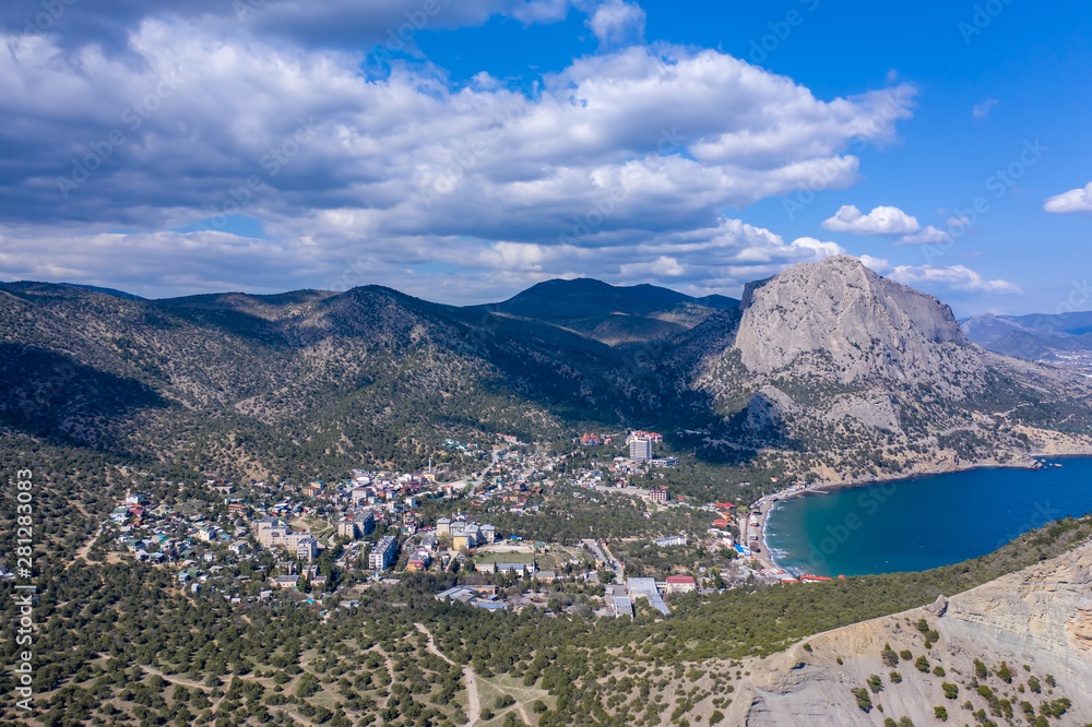 Fototapeta premium Panoramic view towards Green bay of Novy Svet (New World) location from top of Koba-Kaya Mountain, Sudak area, Crimea. Aerial drone view