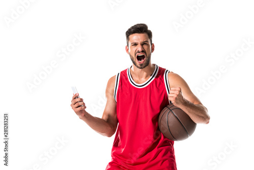 basketball player with ball and smartphone yelling Isolated On White © LIGHTFIELD STUDIOS