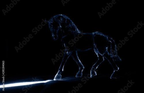 The crystal horse in the moonlight on black background