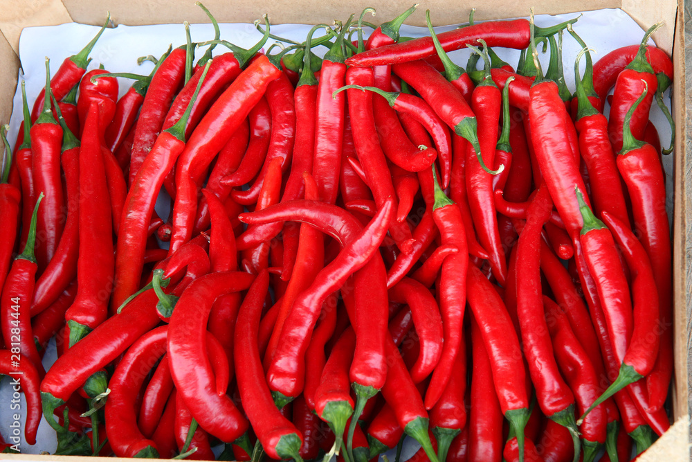 red chili peppers on display at the market