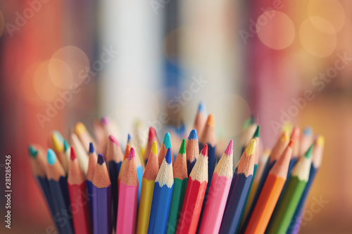 Colorful colored pencils on blurred bokeh background