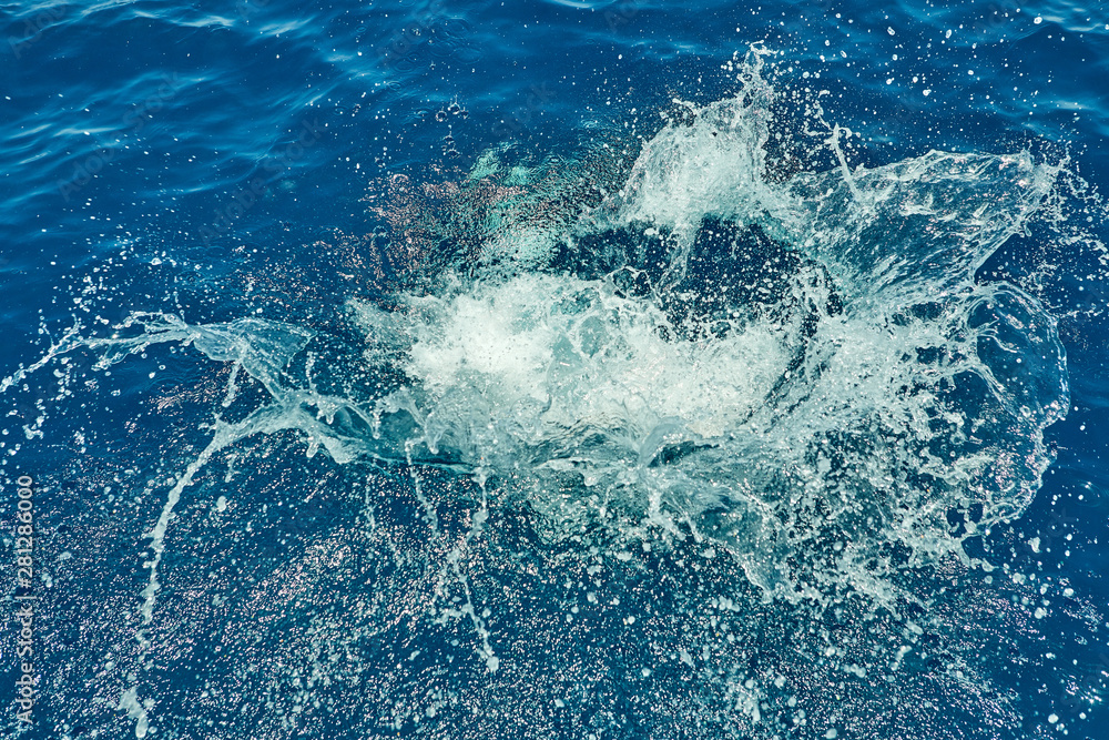 Water splash on the red sea after a jump from a yacht background texture Water splash on the red sea after a jump from a yacht background texture