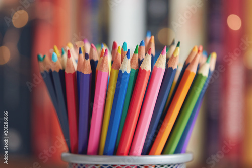 Colorful colored pencils on blurred bokeh background