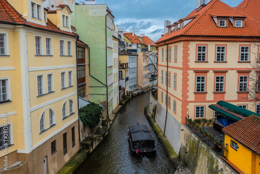 water channel with river of Certovka (Devil's Channel) and boat, also called Little Prague Venice, in district of Lesser Town (Mala Strana) Prague, Czech Republic, Europe