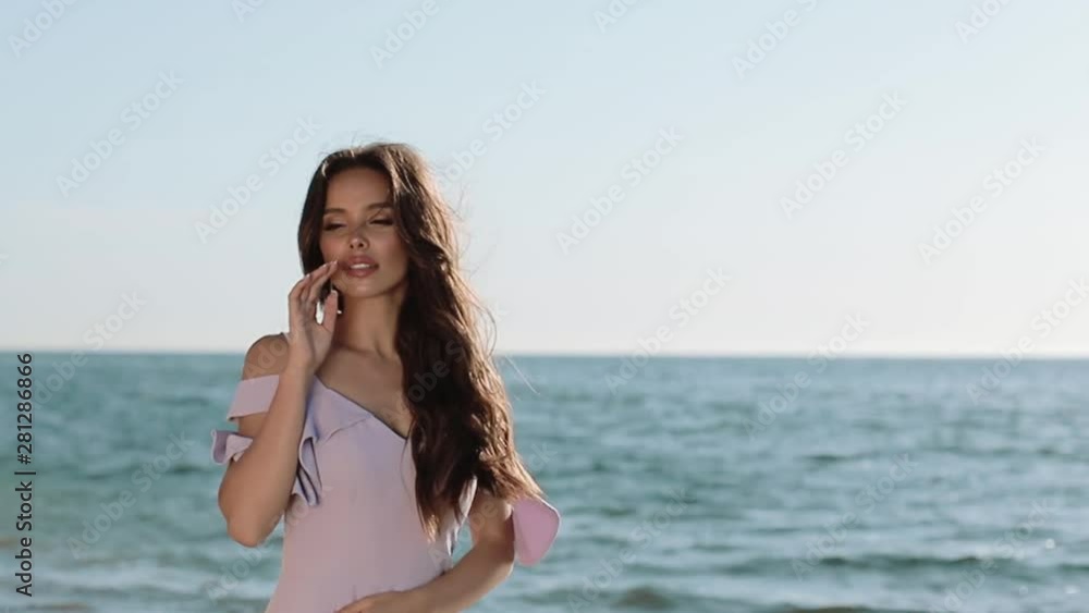 Attractive Girl Is Enjoying At Sea Coast On Summer Vacation Happy Day. Attractive Girl Is Enjoying At Sea Coast On Summer Vacation Happy Day.