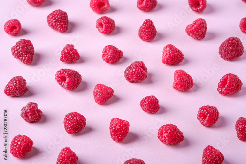 Raspberry sweet organic juicy berries, pattern, texture, on pink paper background