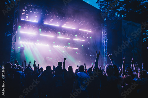 Crowd with raised hands in concert