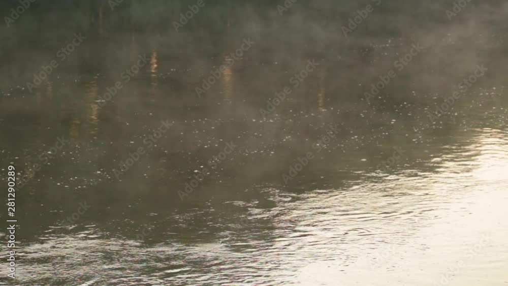 Mist over surface of river water in morning light. Real time full hd video footage. Mist over surface of river water in morning light. Real time full hd video footage.