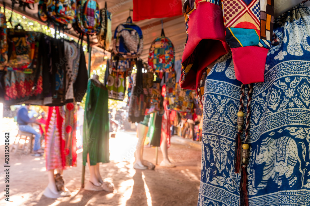 Obraz premium Traditional african market selling colorful backpacks, clothes and fabrics, FEIMA, Maputo, Mozambique