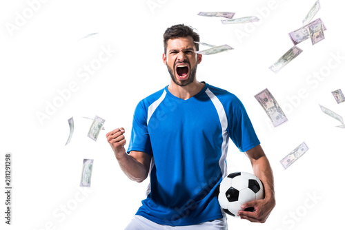 Fototapeta Naklejka Na Ścianę i Meble -  soccer player with ball cheering with clenched hand near falling money Isolated On White