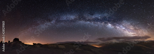 Scenic view of Milky Way over mountains photo