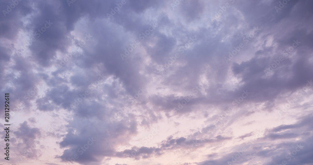 Obraz premium blue sky with white clouds during pink summer sunset
