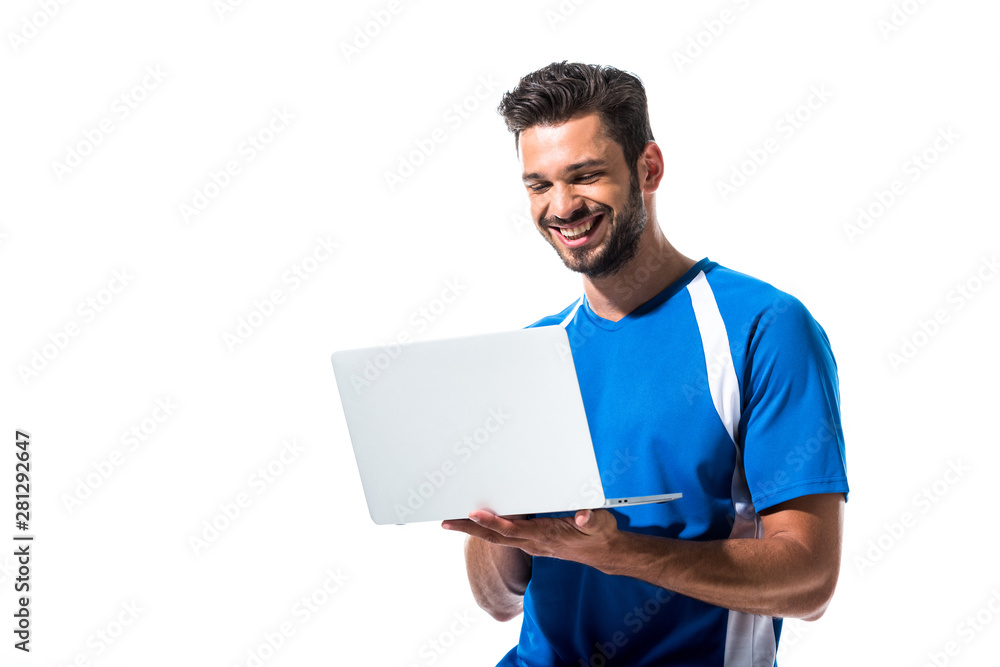 smiling soccer player using laptop Isolated On White smiling soccer player using laptop Isolated On White