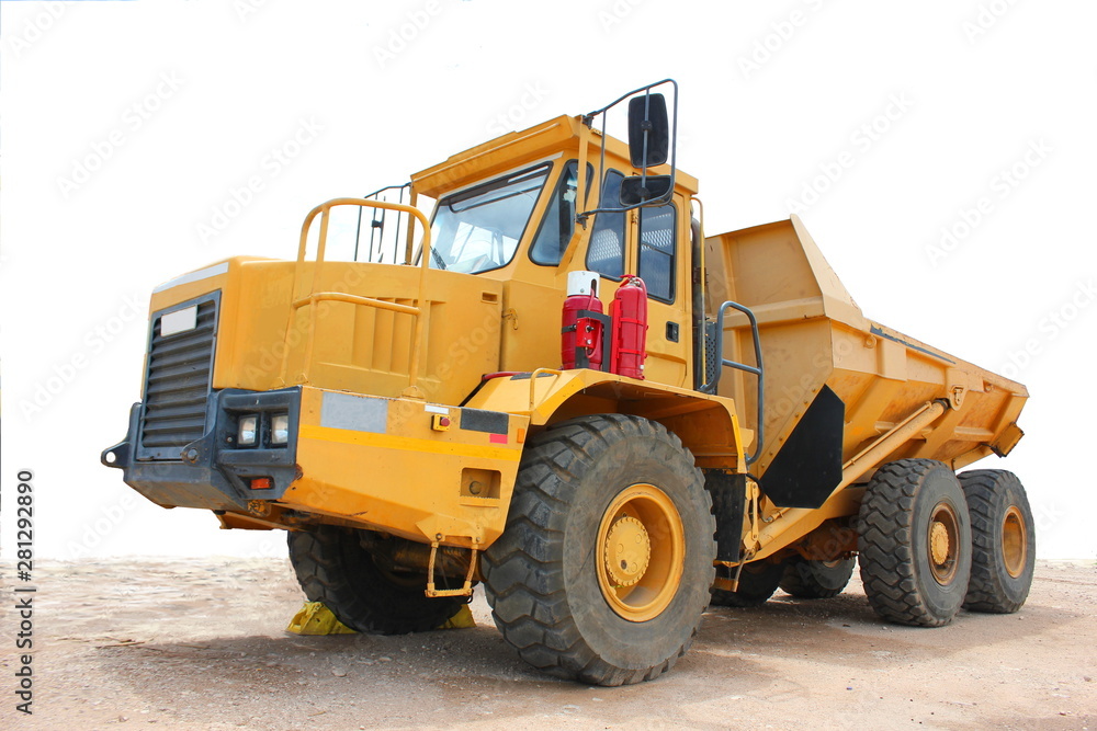 A yellow tipper truck used in the mining industry.These trucks are used to move sand,gravel and soil and assist in the process of mining.