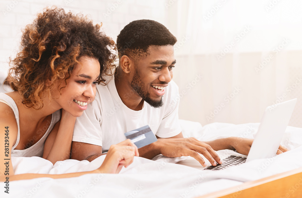 Couple buying online with smartphone and credit card Couple buying online with smartphone and credit card