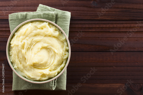 Fresh homemade creamy mashed potato in bowl, photographed overhead with copy space on the right side (Selective Focus, Focus on the potato puree)