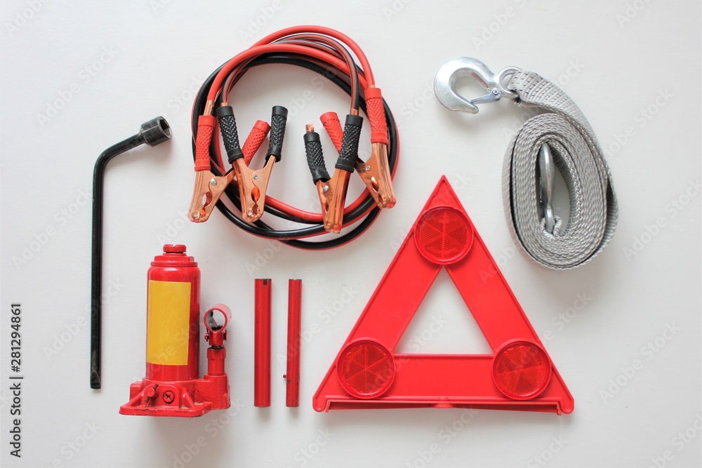 Basic emergency kit for a car consisting of a bottle jack,wheel
