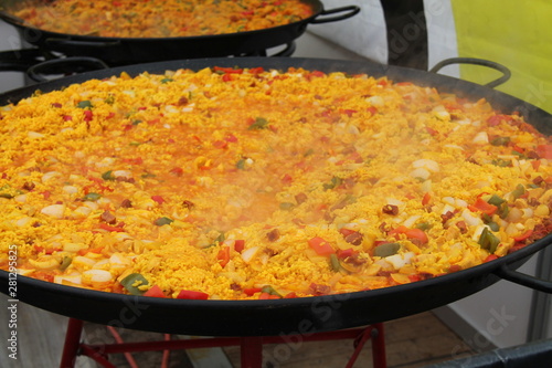 Freshly Made Paella Being Cooked in Large Pans.