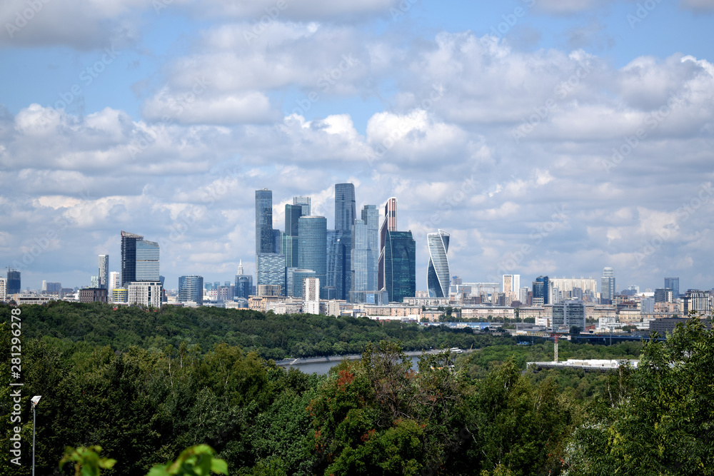 Moscow, Russia - July 8, 2019: The view of the Moscow International Business Center skyscrapers and cloudy sky from the Sparrow Hills observation deck Moscow, Russia - July 8, 2019: The view of the Moscow International Business Center skyscrapers and cloudy sky from the Sparrow Hills observation deck