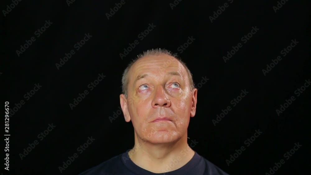 A man does exercises for the eyes making a look in a circle. A man does exercises for the eyes making a look in a circle.