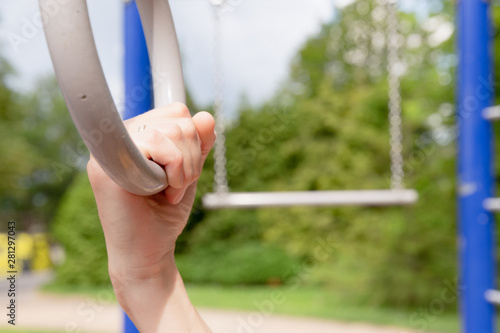 Woman exercising with gymnastic rings