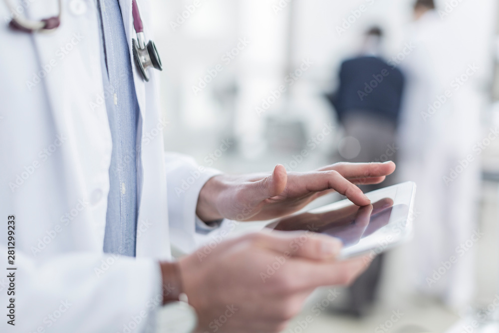 Close-up of doctor using a digital tablet Close-up of doctor using a digital tablet