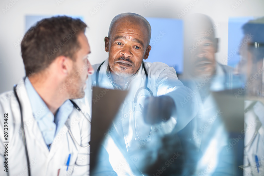 Two doctors analyzing x-ray image Two doctors analyzing x-ray image