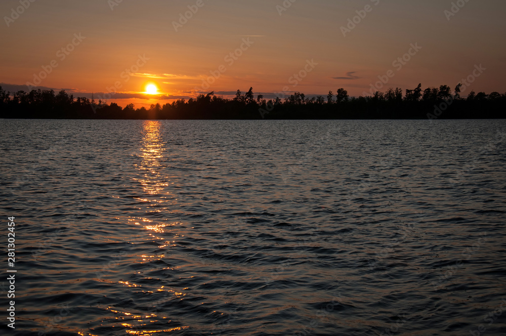 Naklejka premium Summer lake sunset in Sweden