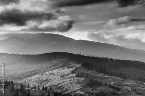 Amazing Carpathian landscape of misty mountain hills and cloudy sky in black and white. Ukraine.