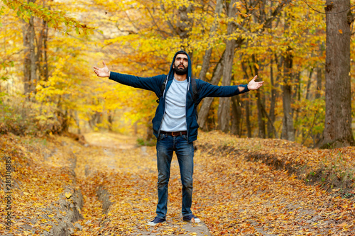 man traveler in colorful forest