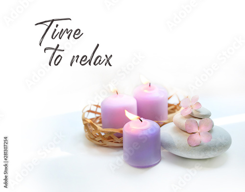 Time to relax. candles, flowers hydrangea, spa stones on white background. Spa therapy composition. Ritual for relaxation, meditation. Gentle spa and wellness background. soft selective focus