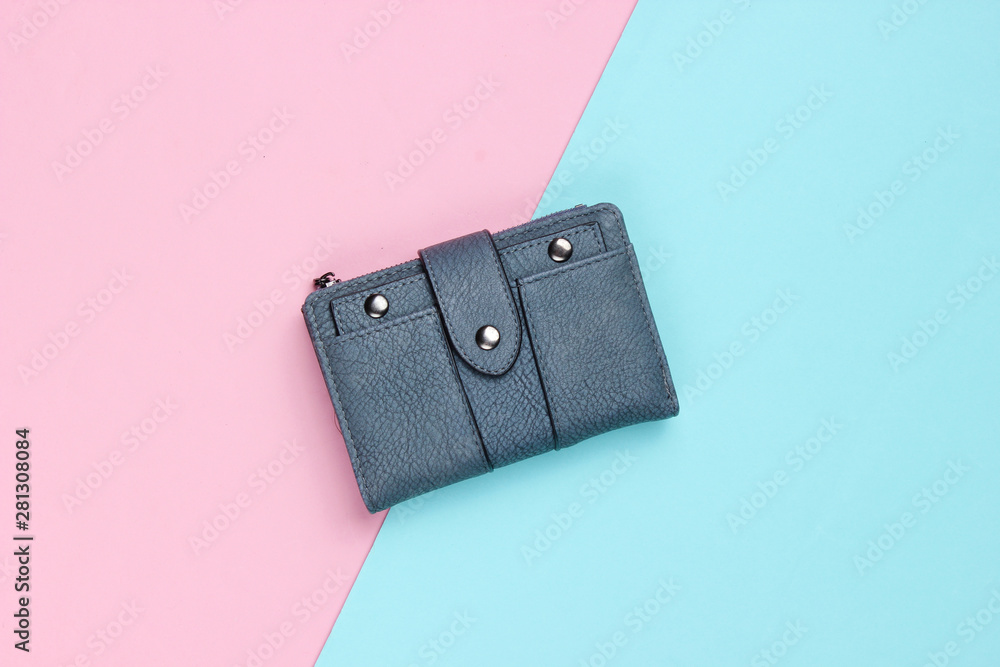 Fashionable leather wallet on a blue-pink pastel background. Top view Fashionable leather wallet on a blue-pink pastel background. Top view
