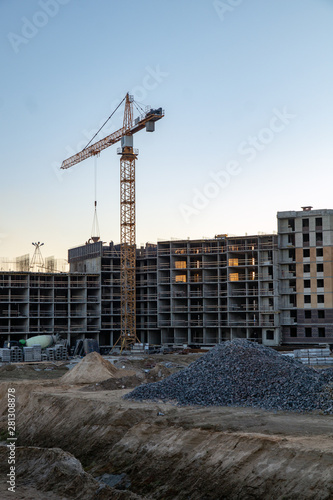 tower crane at the construction site of a multistory building © Ilya Kaifat