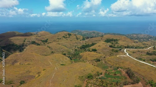 Teletubbies Hill View to The Sea. Drone Shot Tropical Savanna Hills at Nusa Penida, Bali - Indonesia photo